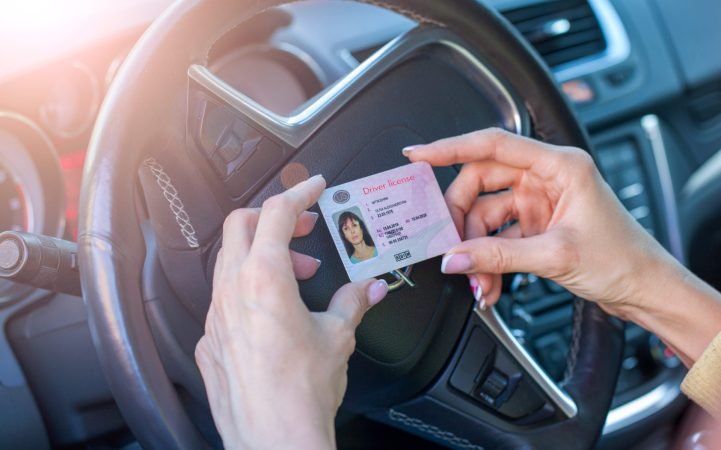 Getting,A,Driver's,License,,Female,Hands,Show,Us,Driving,License,